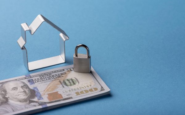 high-angle-banknotes-with-house-lock